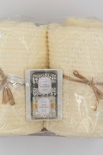 Gift set of towels in a wicker tray wrapped in cellophane - cream