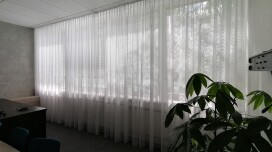 A curtain in the office of the Agel insurance company