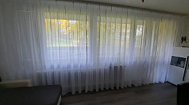 Modern curtain Gerster 11280 in the living room