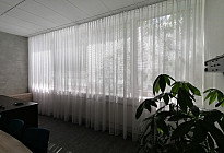 A curtain in the office of the Agel insurance company