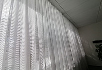 A curtain in the office of the Agel insurance company