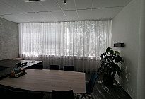 A curtain in the office of the Agel insurance company