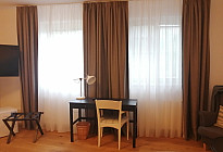 Draperies and curtains in the rooms of Hotel McLimon