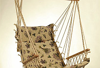 Hanging rocking chair from Czech company Alebo  from tapestry fabrics