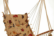 Hanging rocking chair from Czech company Alebo  from tapestry fabrics