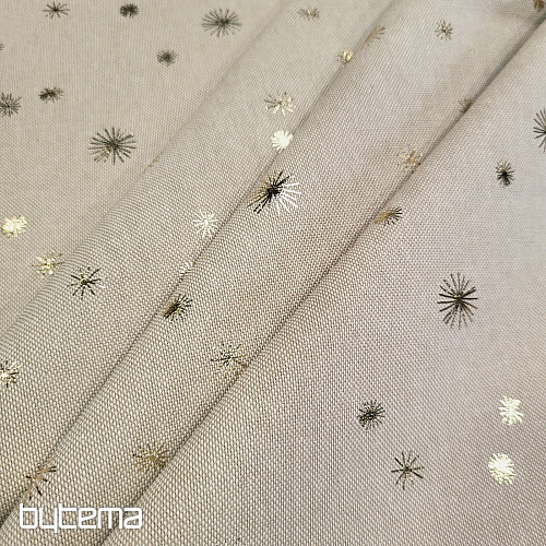 Cotton CANVAS fabric GOLDEN STARS on the cutting board